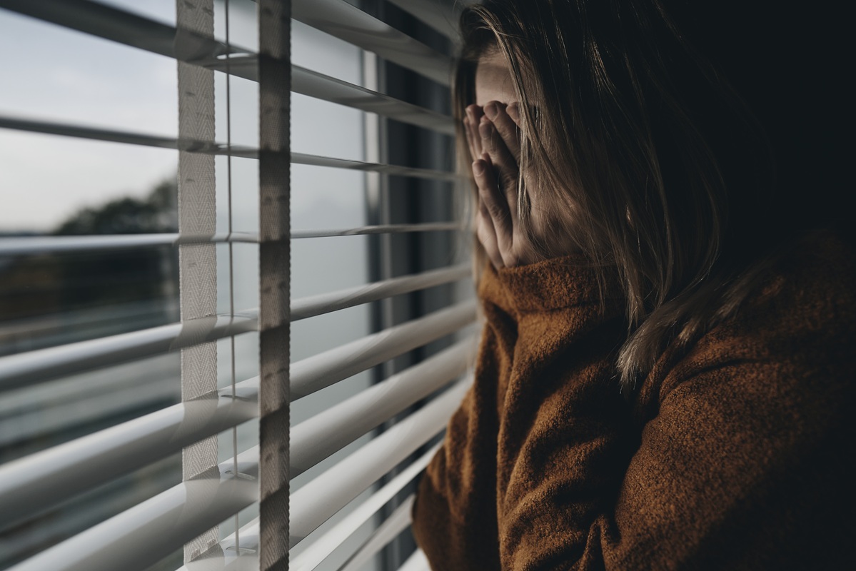 Worried woman cover the face