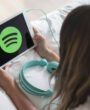 young-woman-holding-tablet-with-spotify-app